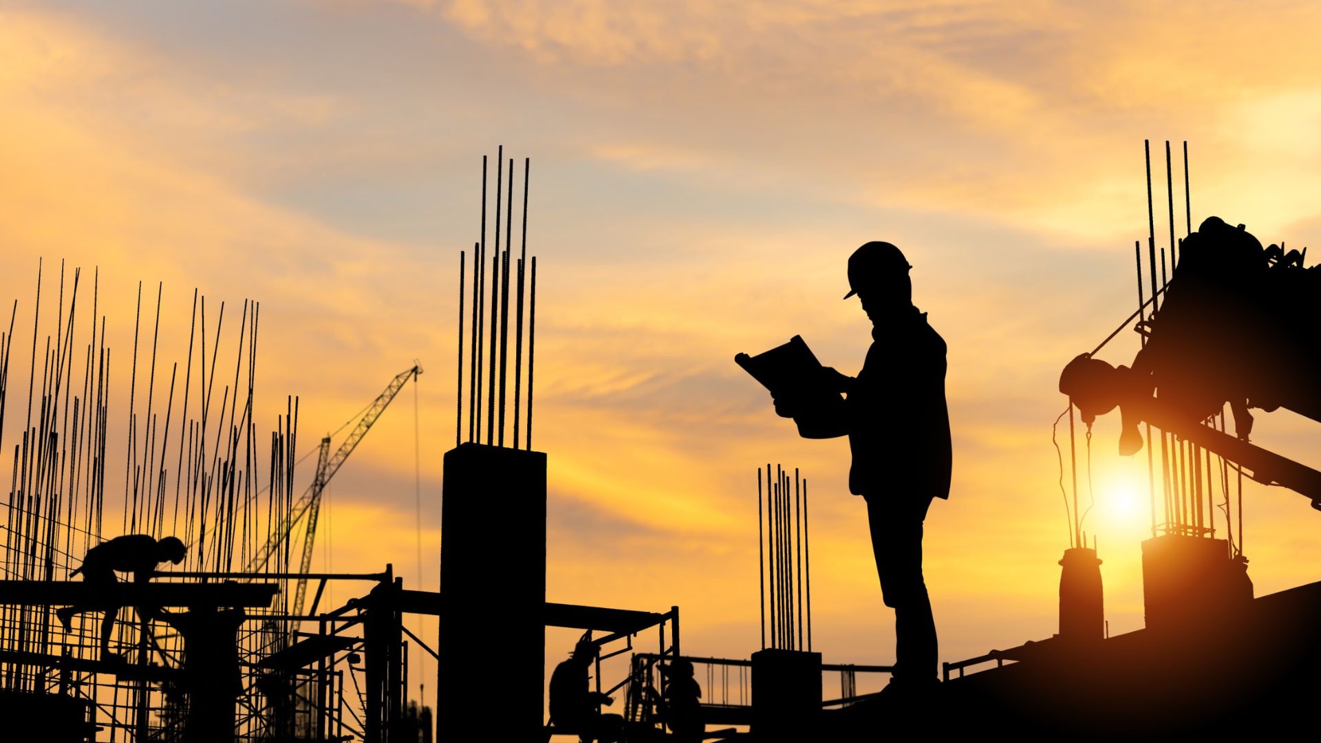 Silhouette of Engineer and workers checking project at building site Silhouette of Engineer and workers checking project at building site